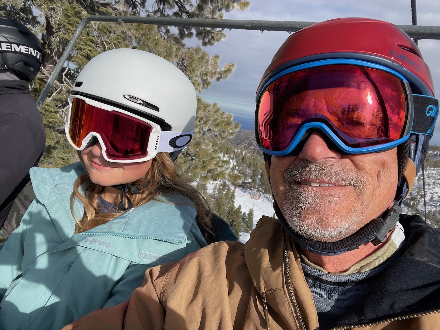 Ruby and Dad on Lift Mt High 3-16-24.jpg